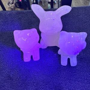 A set of three calcite carving two kitties and one bunny